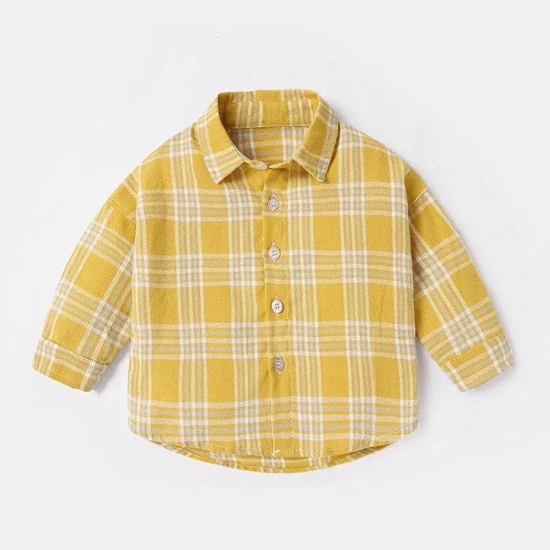 Boy wearing a cotton lattice shirt with animal cartoon print in light blue, long sleeves, casual style.