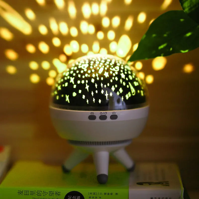 Black and white rotating starlight projection lamp with cartoon style, battery powered.