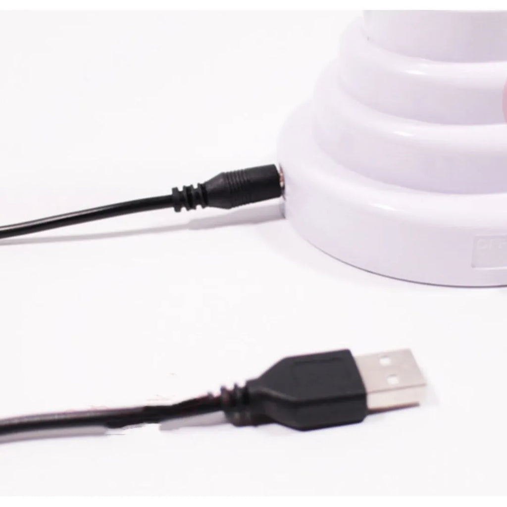 Handmade white bamboo-shaped desk lamp emitting green light, shown in two size options.