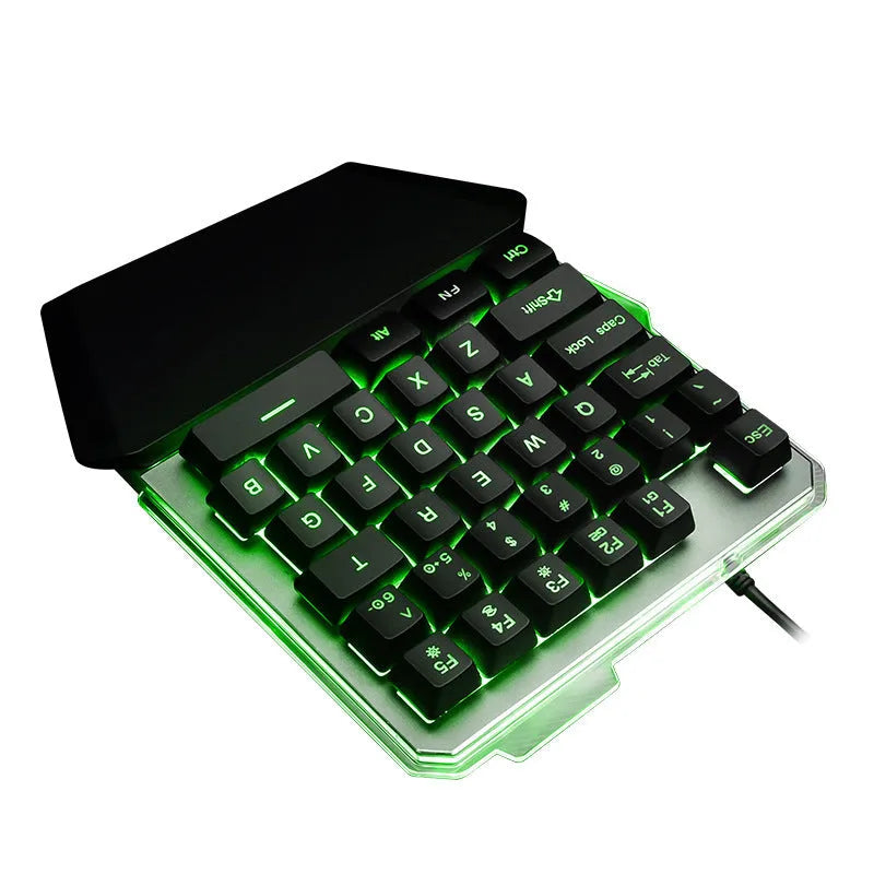G40 Flow black one-handed robotic keyboard with RGB backlight on a desk.