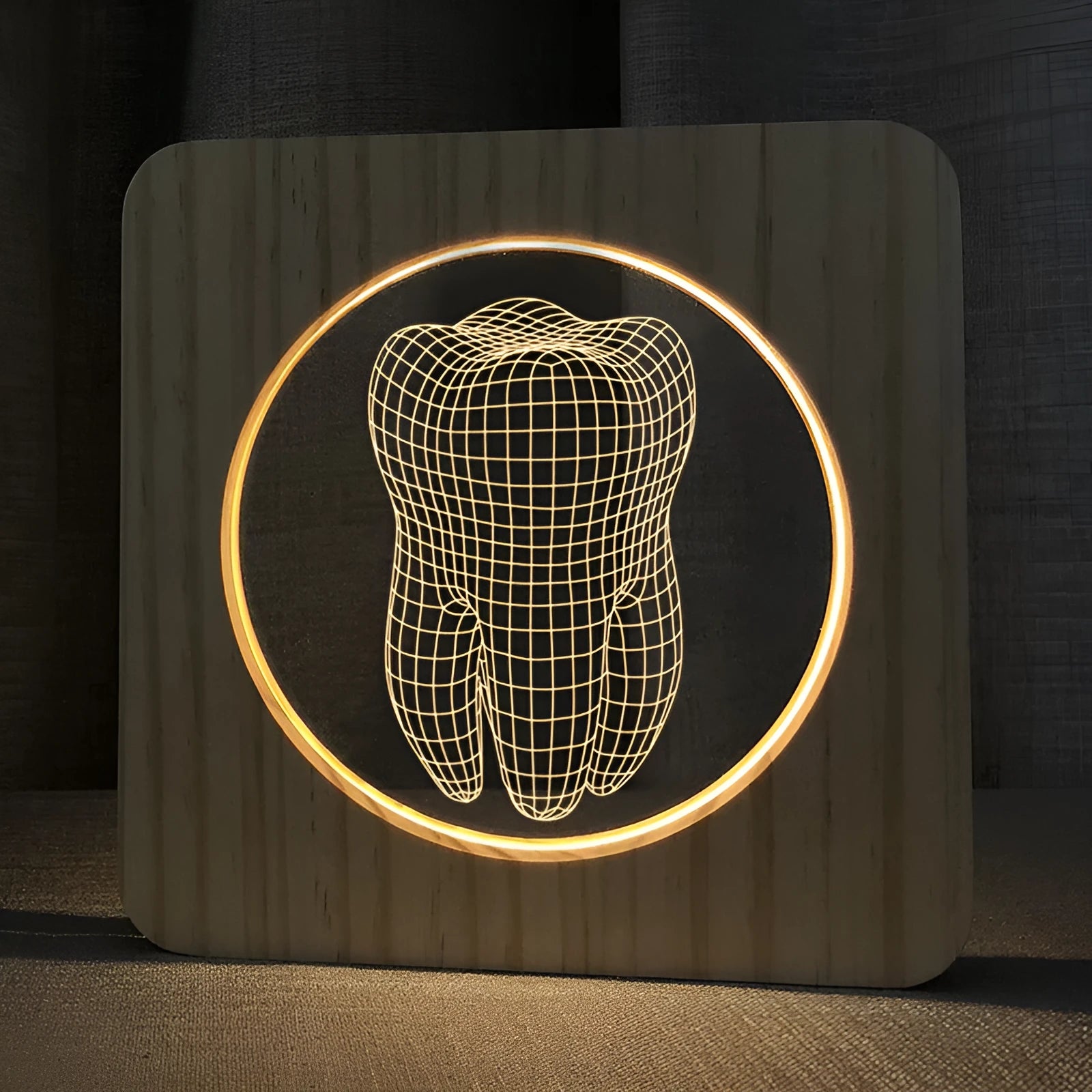 Wood colour tooth-shaped acrylic USB night lamp on a surface