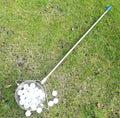 Stainless steel golf ball picker with a metallic finish on a green background.