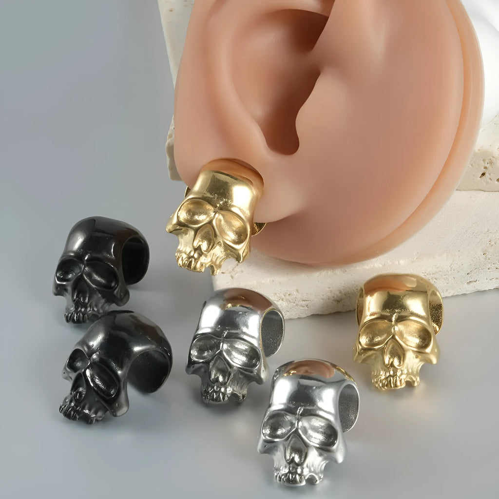 Stainless steel hollow skull Buddha head geometric earrings in four colour options.