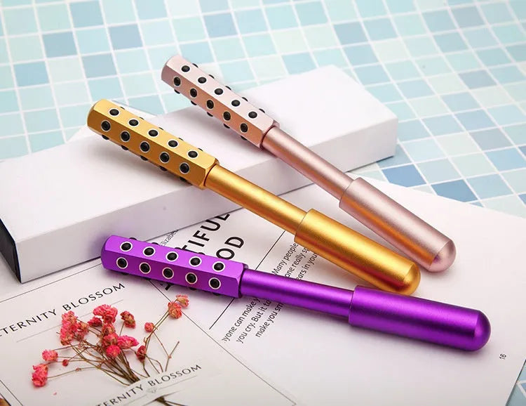 Purple beauty massage roller with germanium particles, 193 mm long, for facial and eye contouring.