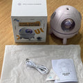 Astronaut-shaped portable USB humidifier with LED light on a desk