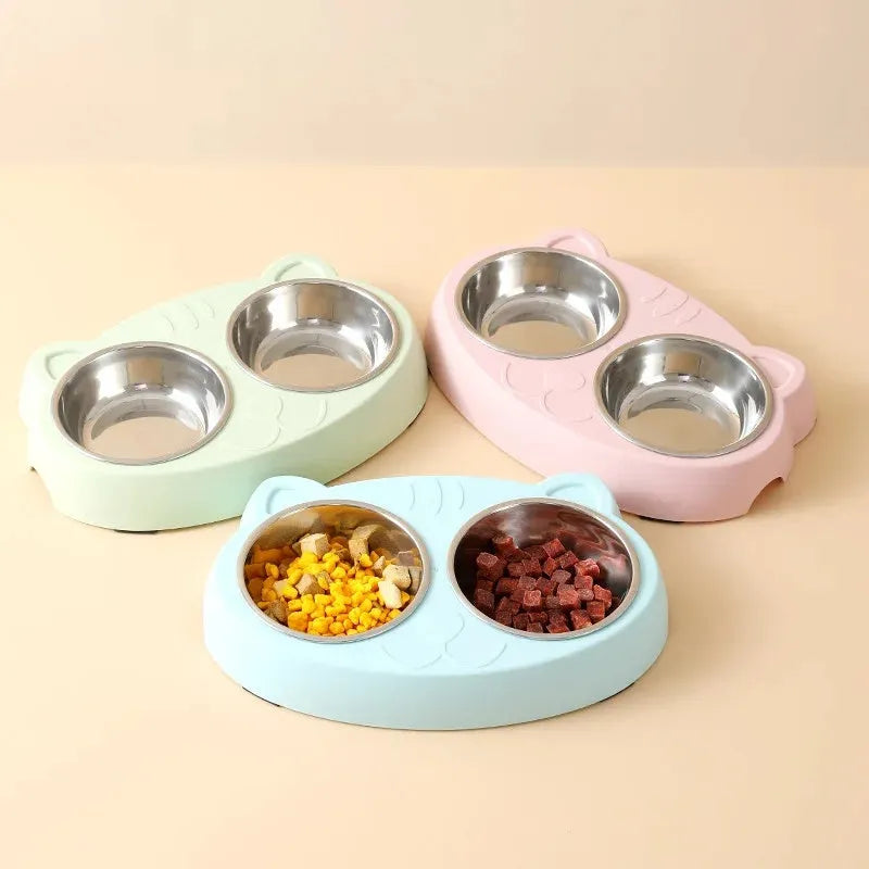 Blue macaron-shaped plastic pet feeder with two bowls for food and water