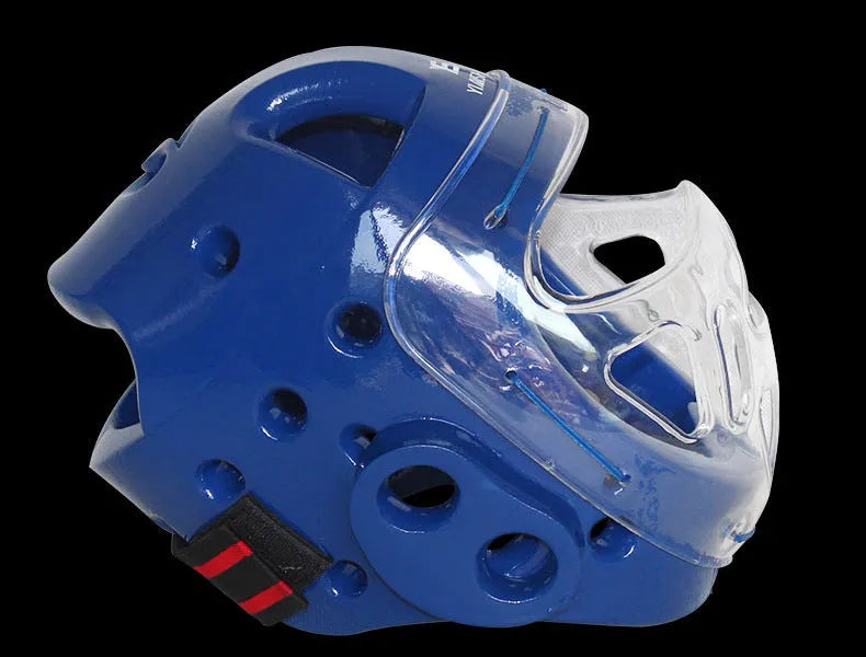 A white, blue, and red karate boxing helmet with chin strap for head protection.