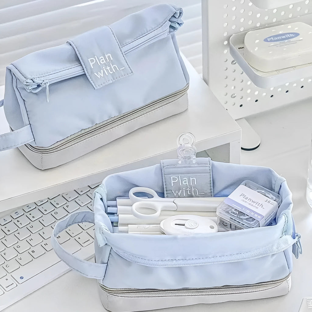 Foldable double-layer student pencil case in dark blue, blue, and cream white colours.