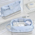 Foldable double-layer student pencil case in dark blue, blue, and cream white colours.