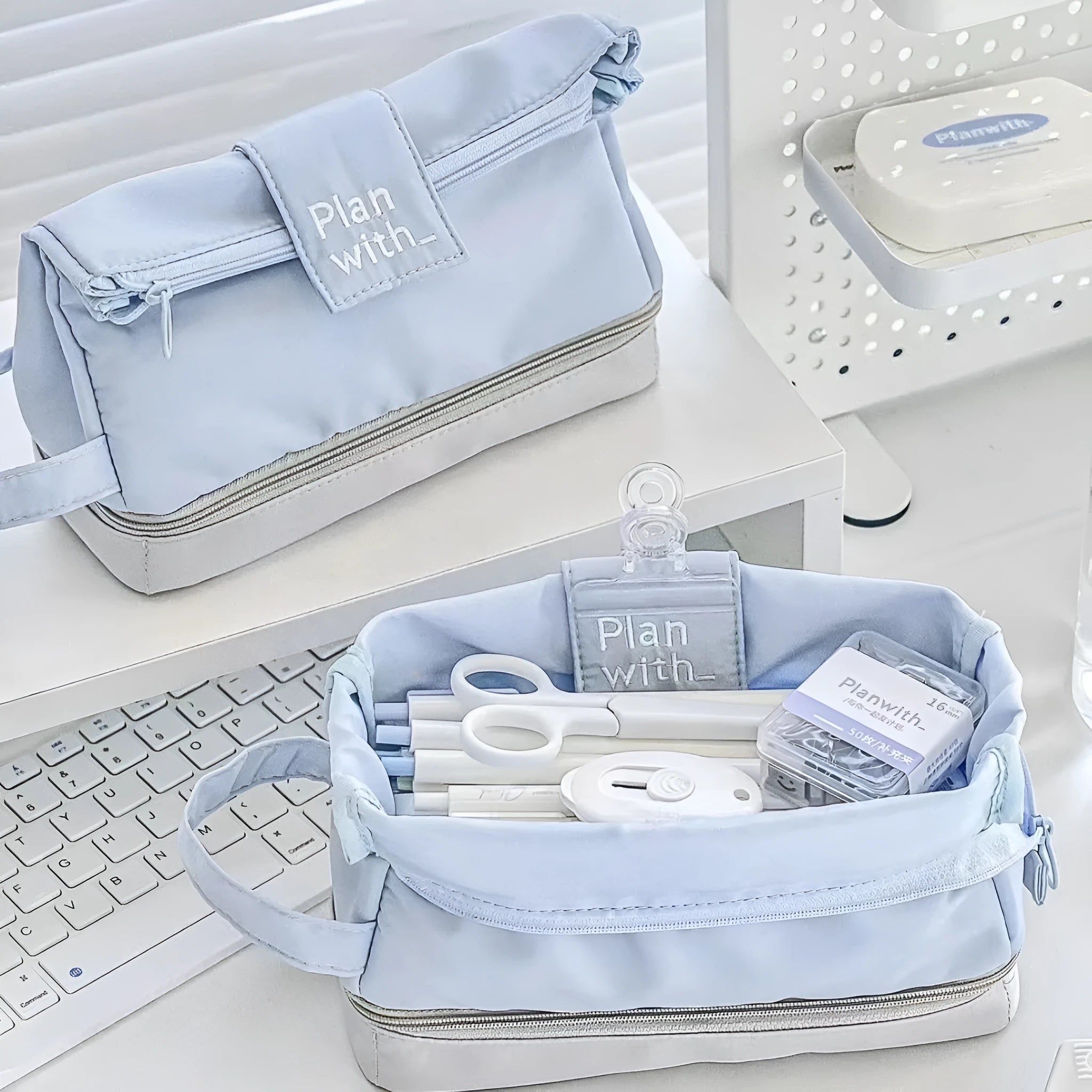 Foldable double-layer student pencil case in dark blue, blue, and cream white colours.