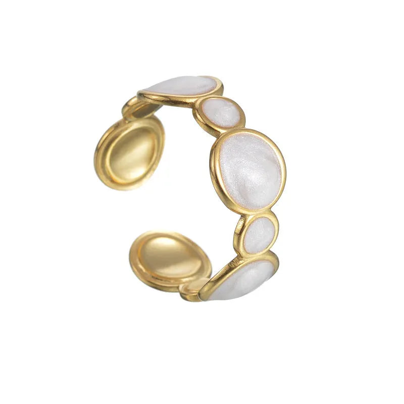 Adjustable stainless steel ring with a geometric shape and electroplated metallic finish.