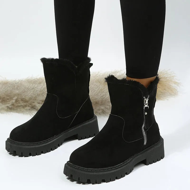 Women's black high-top faux suede snow boots with side zip and thick plush lining on a rubber sole.