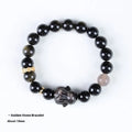 Handmade obsidian bracelet with lying rabbit charm, grey agate beads and brass metalwork in national style