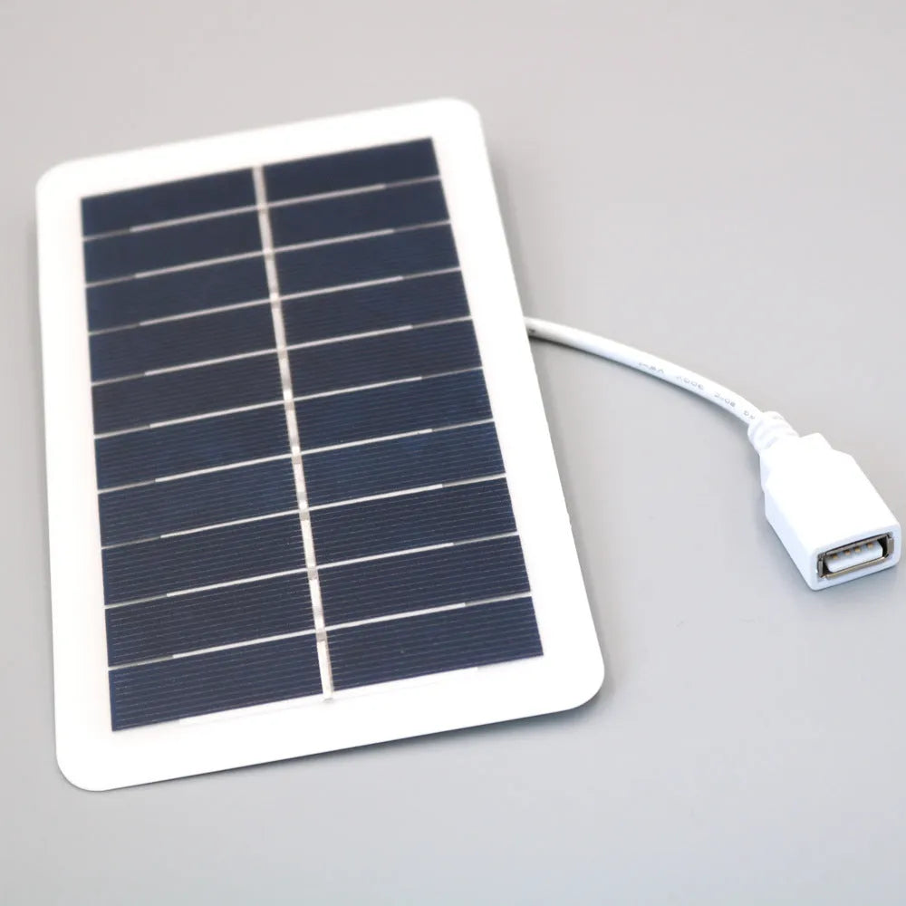 Black portable solar panel charger with USB port for mobile phone charging