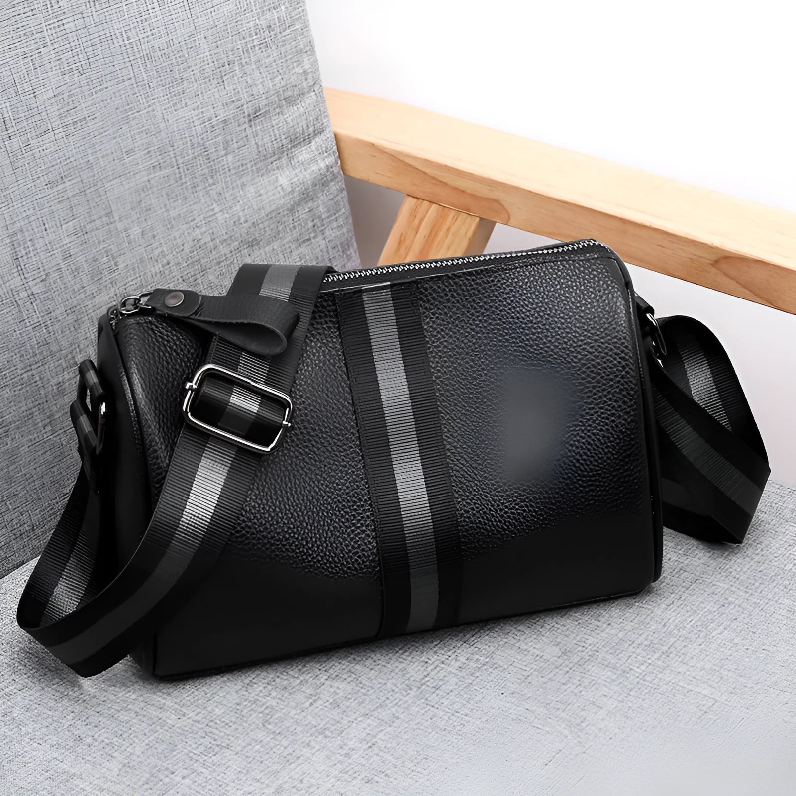 Black genuine leather one-shoulder crossbody bag with a single strap.