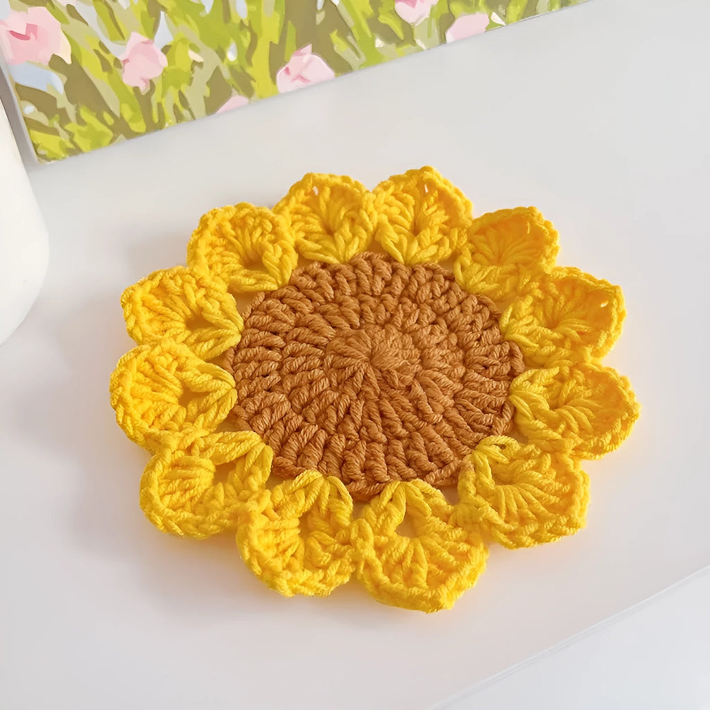 Hand-woven circular wool coaster with flower pattern, 10cm diameter