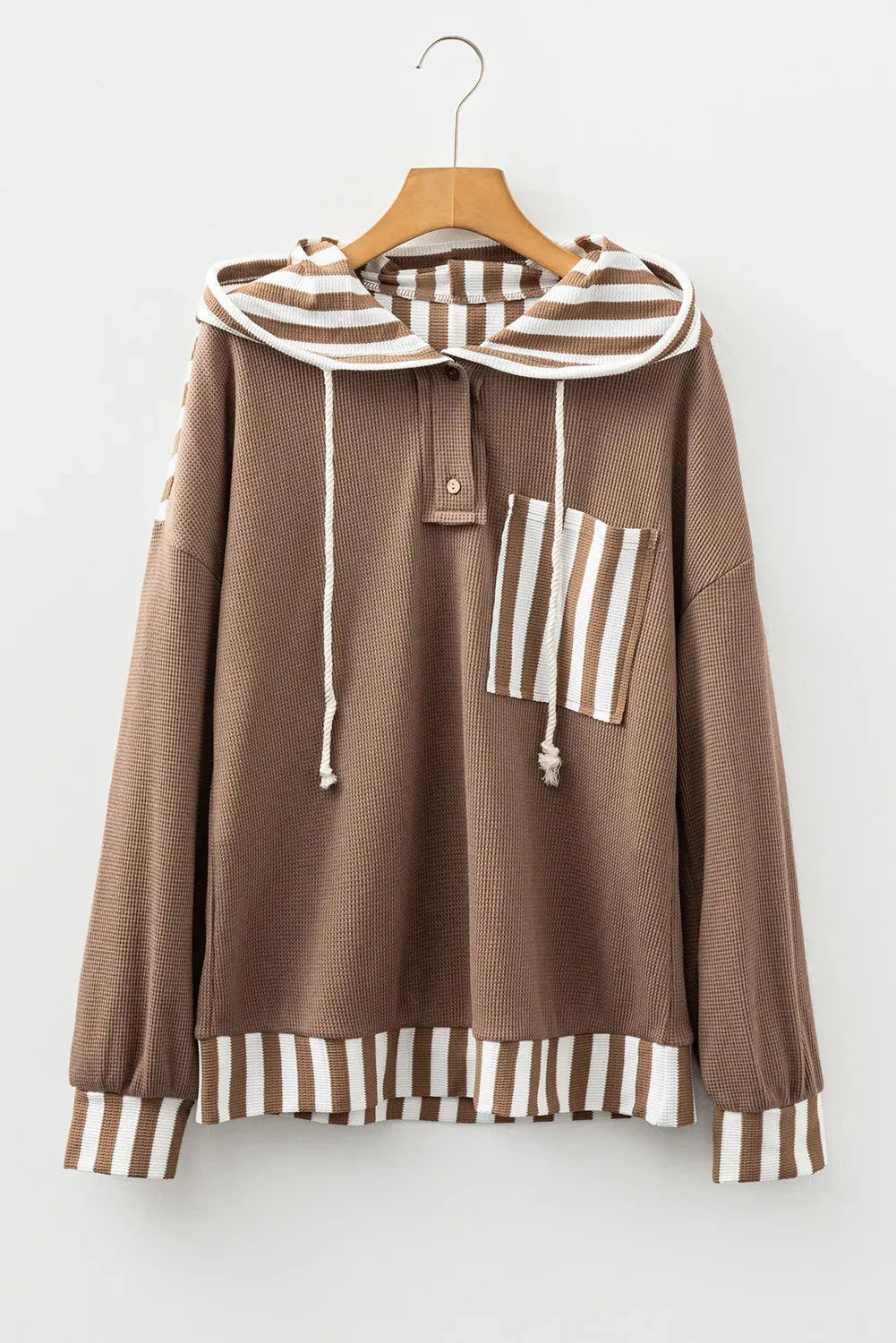 Straw yellow waffle texture hoodie with striped patchwork and a button neck.