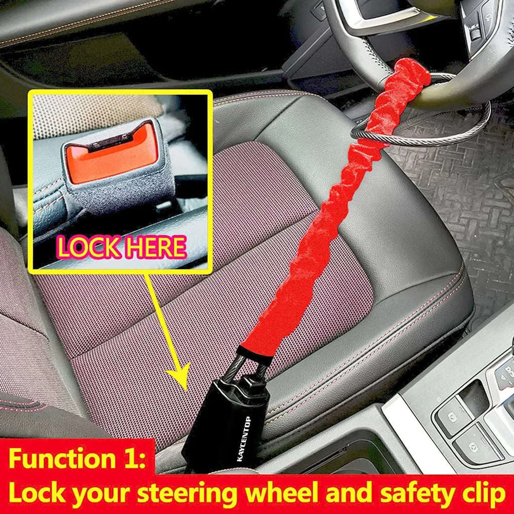 Red car steering wheel lock with iron cable secured around a steering wheel.