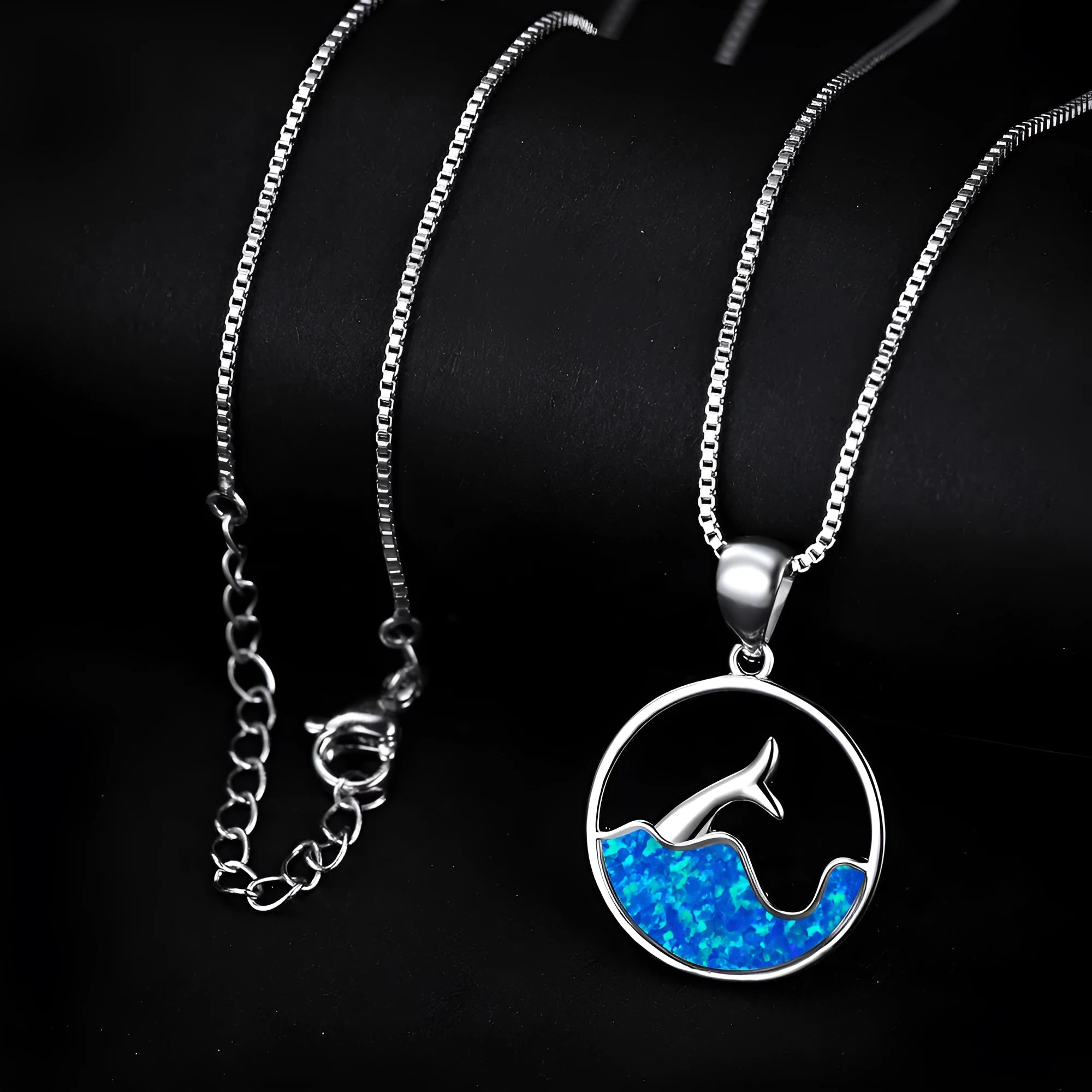 Geometric fishtail pendant necklace with round elements in platinum blue opal colour