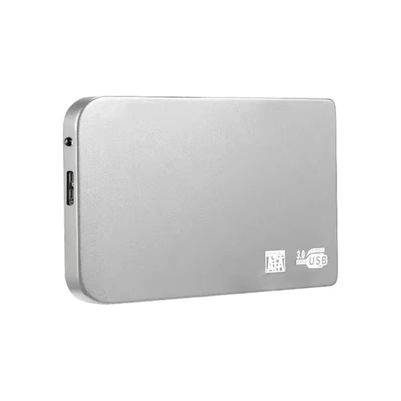 Silver USB 3.0 solid state mobile hard disk with data cable on a desk.