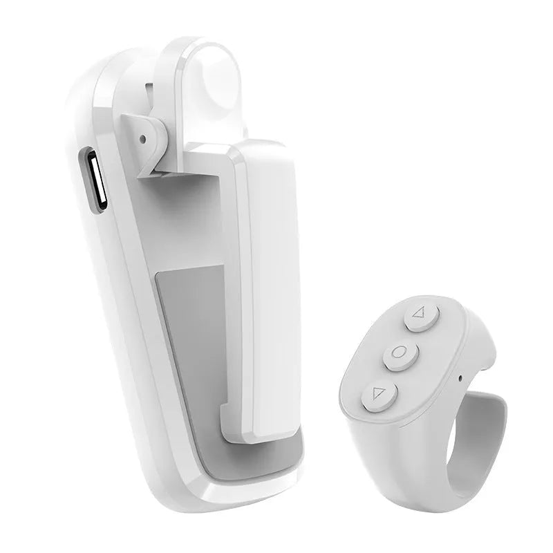Wireless page turner remote control with clicker attachment in black, white, or pink colour.