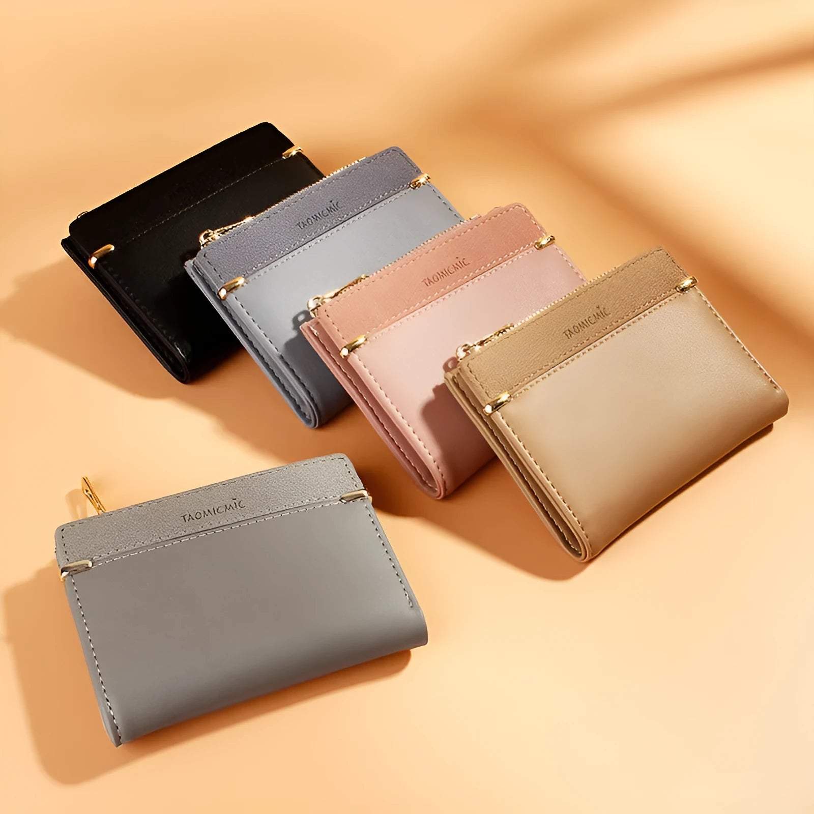 Ladies wallet in PU leather with multiple card slots, zipper closure, and two-fold design shown in various colours.