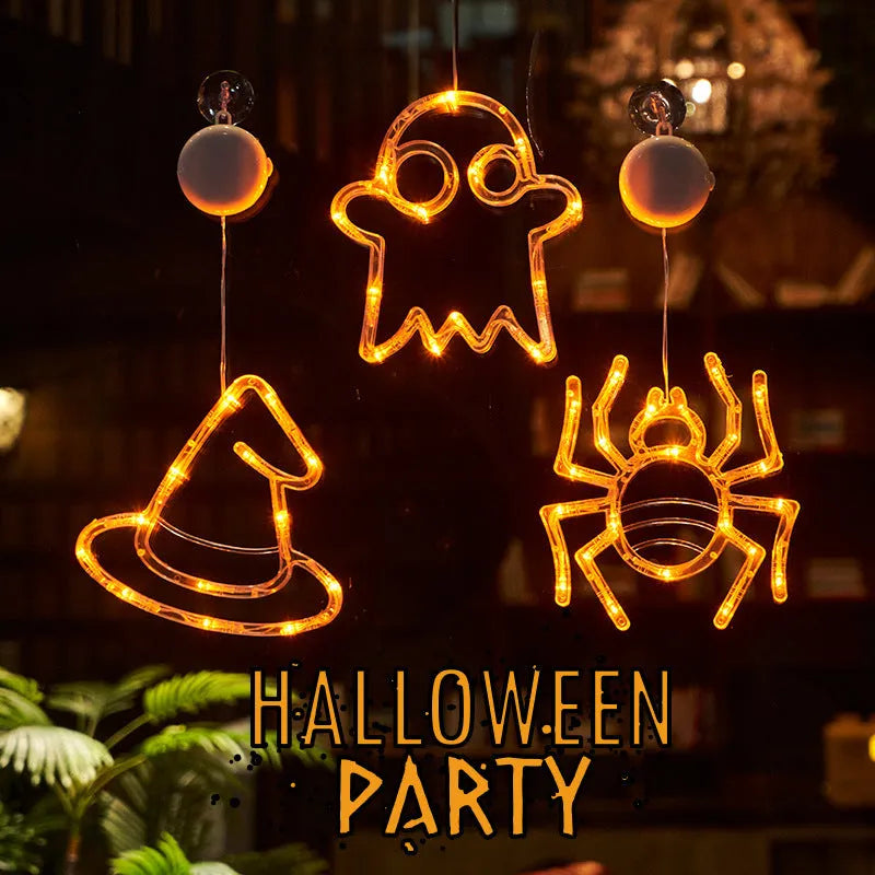 Halloween LED window lights with suction cups showing ghost, spider, and pumpkin decorations