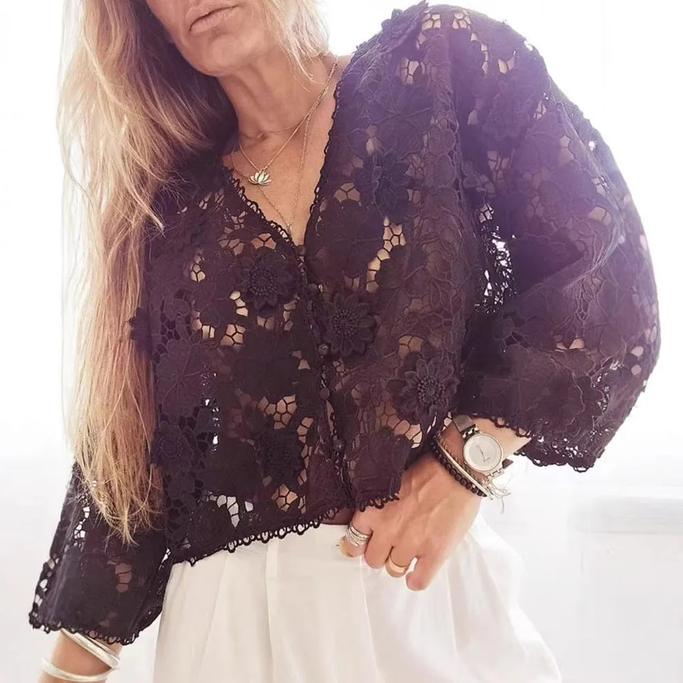Loose black lace V-neck cardigan with a three-dimensional lace flower decoration on the chest.
