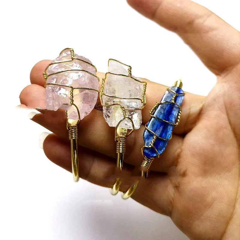 Geometric bracelet made of natural rough crystal stones wrapped with gold-coloured wire