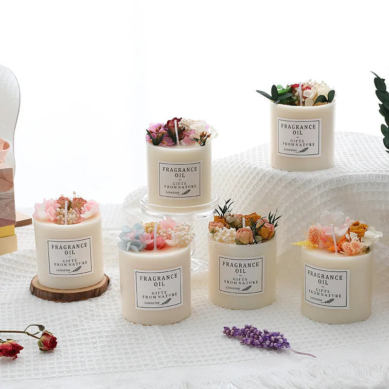 Decorative dried flower candle in jar with wooden chip base, available in nine botanical scents
