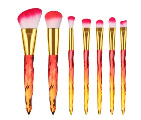 10 clear crystal handle foundation brushes with diamond shanks, showing black, blue, red, and yellow colour options.