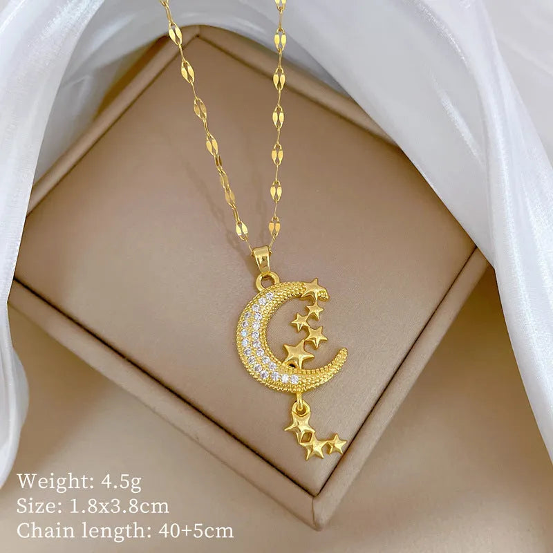 Geometric moon tassel necklace with diamond detail on a stainless steel chain.