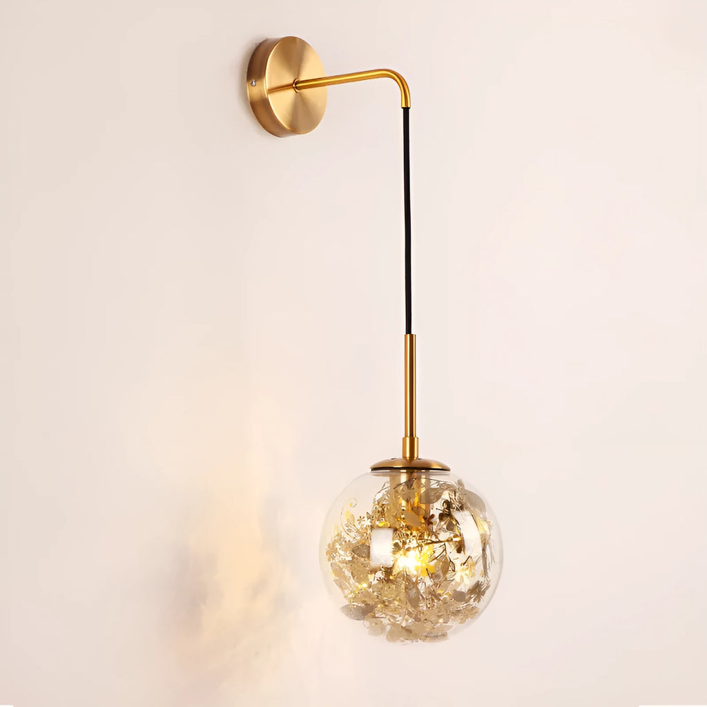 Modern simple glass bedside wall lamp in silver or gold finish on a white wall.