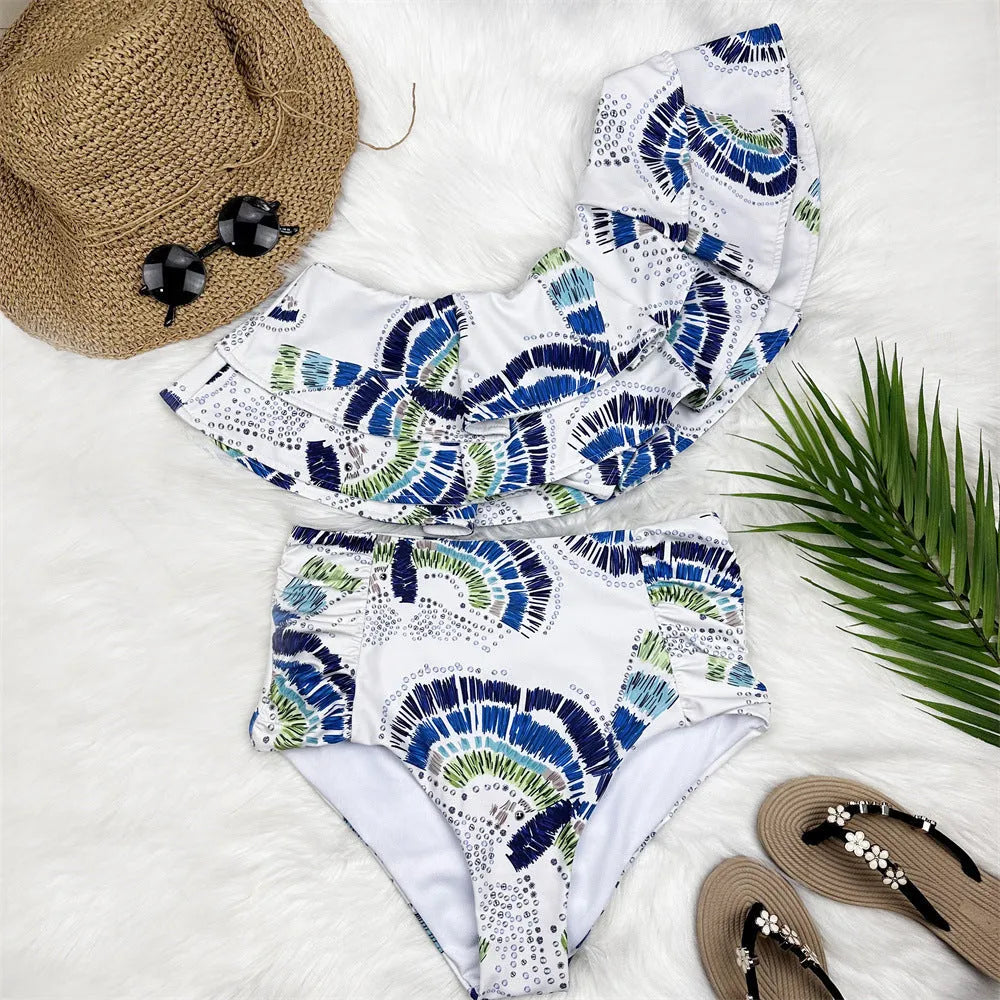 White women's one-shoulder swimsuit with lotus leaf detail and split side design