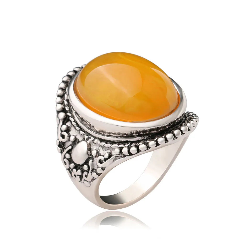 Fluorescent beeswax alloy electroplated ring in antique silver amber colour with a geometric retro design.