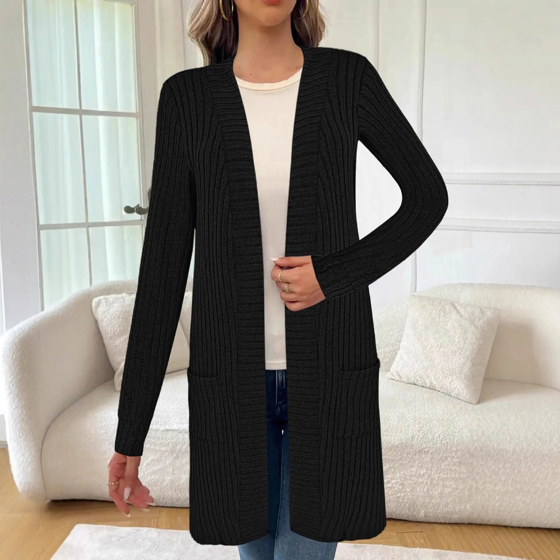 Long sleeve loose fit cardigan jacket with pockets in polyester fabric shown in black colour