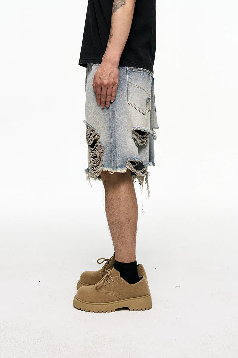 Men's light blue retro washed baggy denim shorts on a hanger