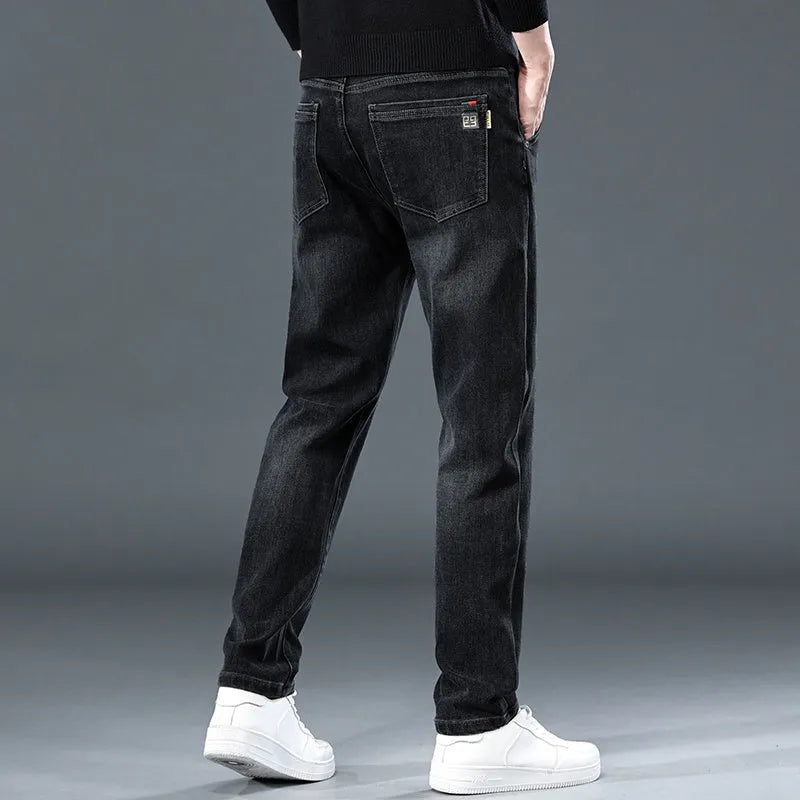Blue grey slim straight casual trousers with a zipper fly on a mid-waist.