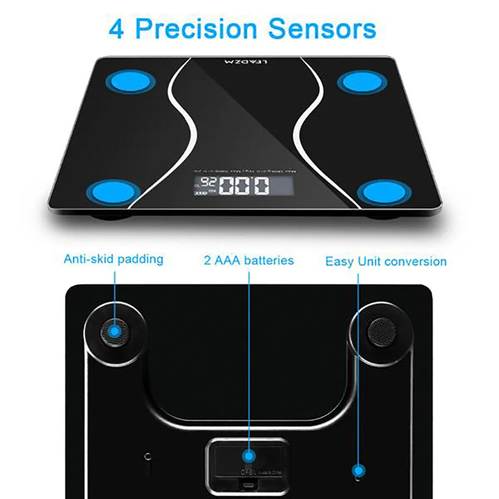 Black electronic household bathroom scale on a floor.