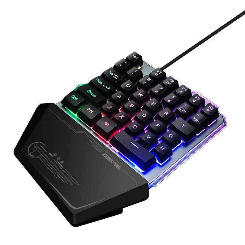 G40 Flow black one-handed robotic keyboard with RGB backlight on a desk.