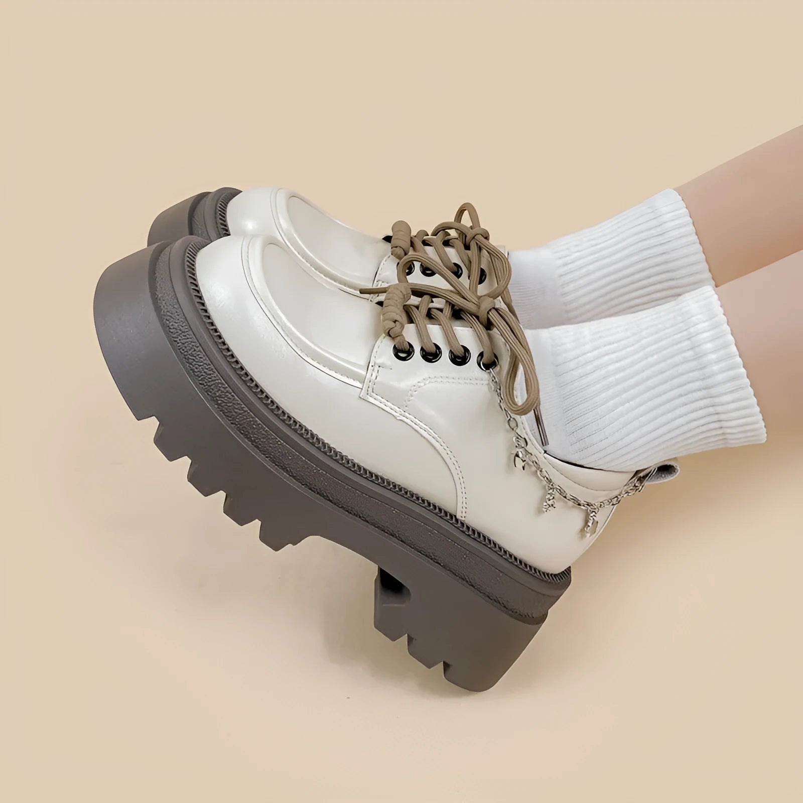 White women's platform leather shoes with lace-up front and a thick chunky heel.