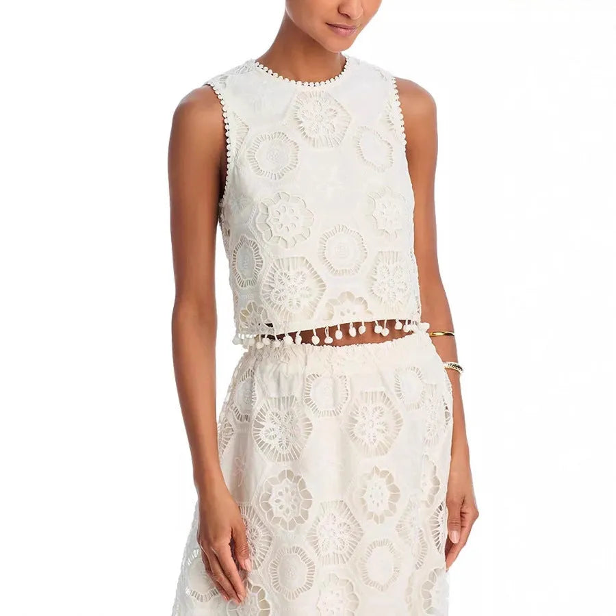 White women's sleeveless top and long skirt suit set with retro embroidery detail