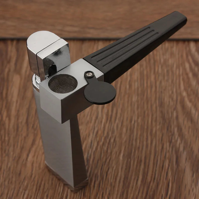 Silver foldable metal pipe lighter in open position showing flame mechanism and storage compartment.