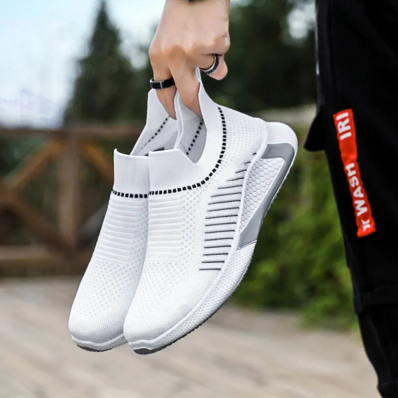 Men's black and white striped mesh sock sneakers with lace-up front and round toe.