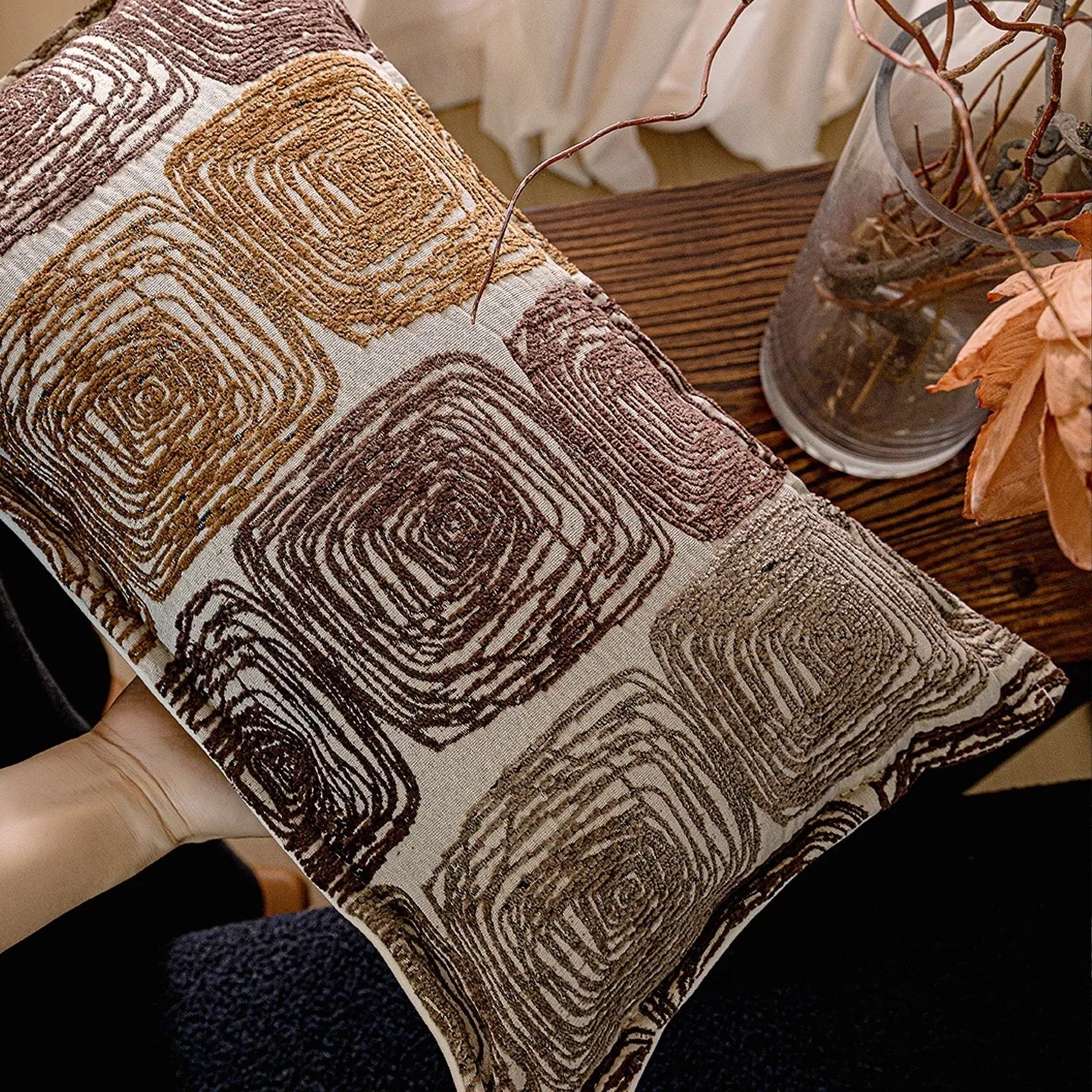 Cream and coffee-coloured abstract coil pattern on a 30x50cm square polyester pillow cover.