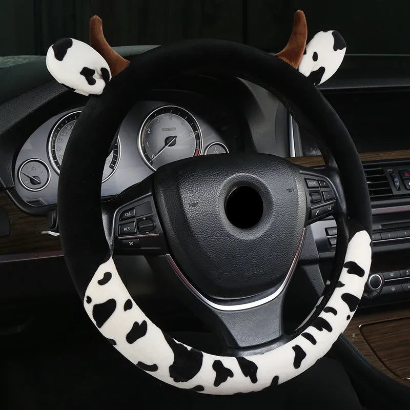 Short plush steering wheel cover in black colour showing comfortable grip surface