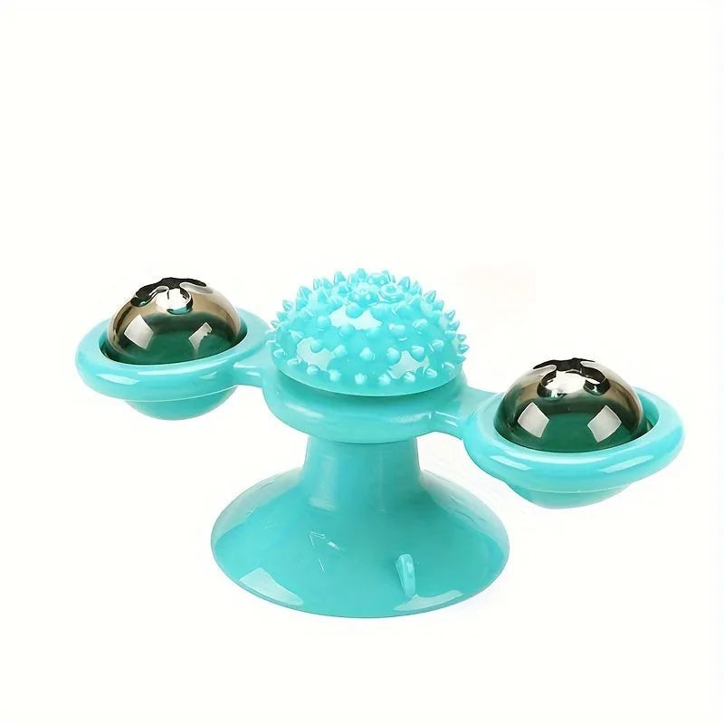 Rotating windmill cat toy with LED light and catnip balls on a white wall