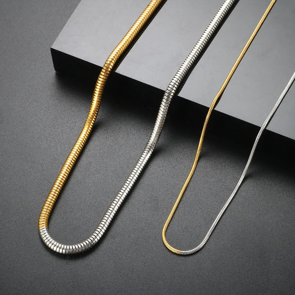 Golden 3mm thick stainless steel snake bone chain necklace for women.