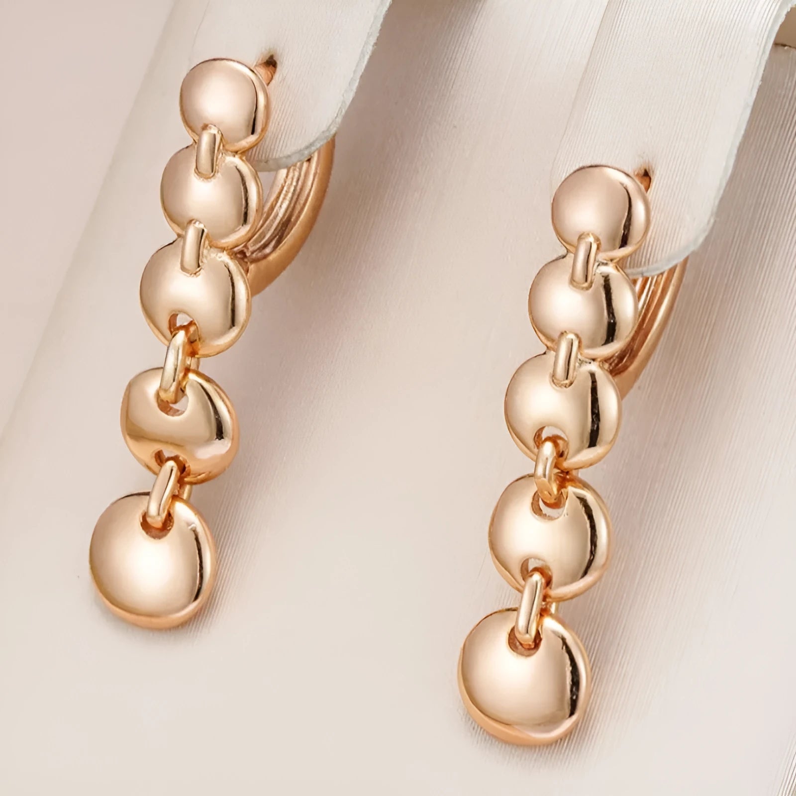 A pair of gold retro woven copper large circle hoop earrings.
