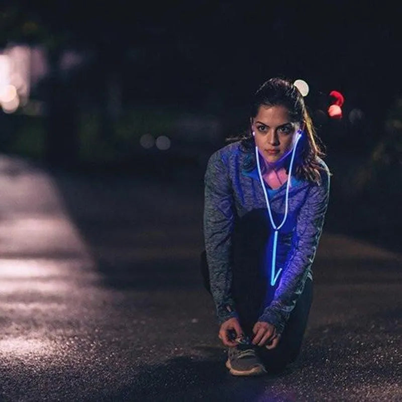 Blue LED light-up earphones with 3.5mm jack and inline remote control, showing illuminated ear shells.